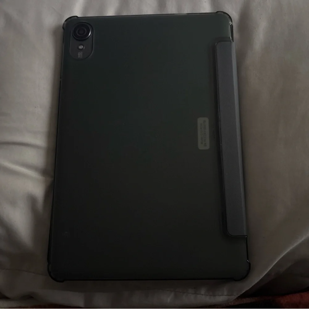 Sleek Blue Tablet with Cosmic Display and Modern Design